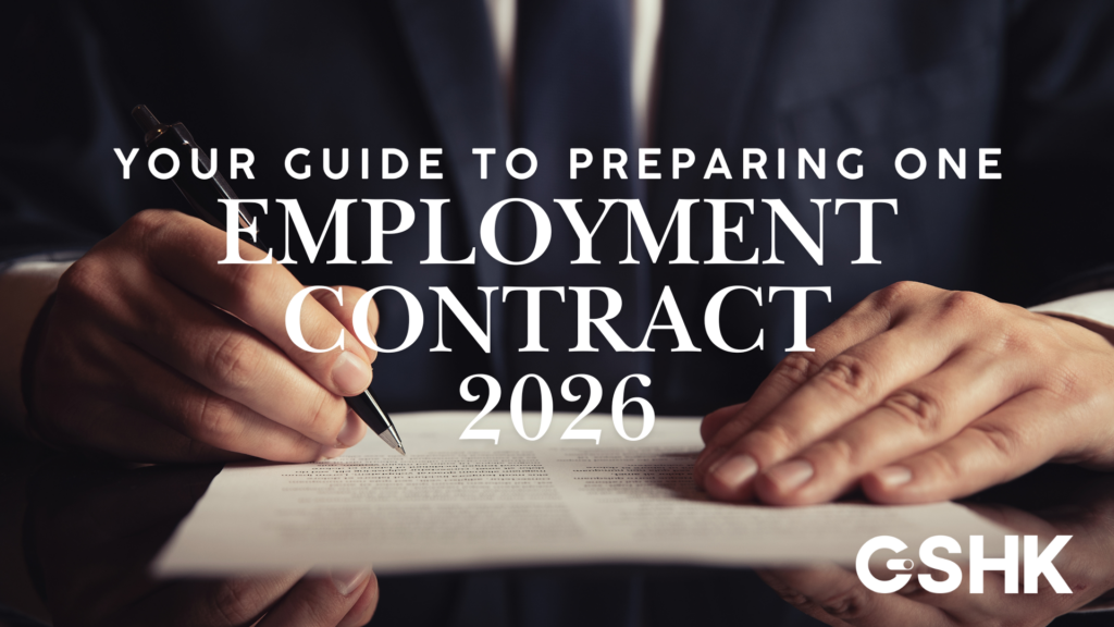 Your Guide to Preparing One Employment Contract 2026, featuring a close-up of a business professional's hands signing a legal document.