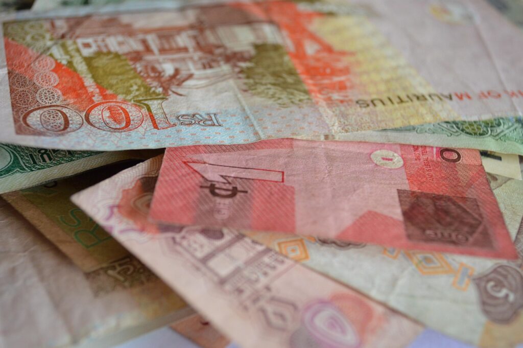 Indian Rupees laid out on a desk